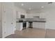 Stylish kitchen boasting white cabinetry, granite counters, and stainless steel appliances at 3394 Vesara Dr, Davenport, FL 33837
