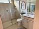 Modern bathroom with glass shower, neutral colors, and decorative decor at 3397 Sagebrush St, Harmony, FL 34773
