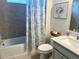 Well-lit bathroom featuring a shower-tub combination and stylish decor at 3397 Sagebrush St, Harmony, FL 34773