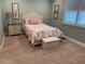 Comfortable bedroom featuring soothing paint color, bench seat, and bright window at 3397 Sagebrush St, Harmony, FL 34773
