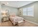 Charming bedroom with soft colors, a comfortable bed, and ample natural light from the window at 3397 Sagebrush St, Harmony, FL 34773