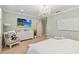 Spacious bedroom featuring a chandelier, a TV, a dresser, and a view of the walk-in closet at 3397 Sagebrush St, Harmony, FL 34773
