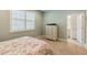 Comfortable bedroom with plush carpet, neutral walls, and abundant natural light from the large window at 3397 Sagebrush St, Harmony, FL 34773