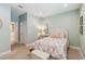 Serene bedroom features a cozy bed, light green walls, and neutral carpet providing a comfortable retreat at 3397 Sagebrush St, Harmony, FL 34773