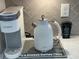 Coffee station setup featuring a Keurig, Ascot kettle, and decorative coffee-themed accents at 3397 Sagebrush St, Harmony, FL 34773