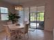 Bright dining area with chandelier and sliding glass doors to the outdoor patio at 3397 Sagebrush St, Harmony, FL 34773