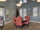 Cozy dining room area featuring a round table, six chairs, natural light, and serene decorative artwork at 3397 Sagebrush St, Harmony, FL 34773