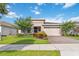Beautiful home with a well-manicured lawn and landscaped front yard and a brick driveway at 3397 Sagebrush St, Harmony, FL 34773