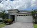 Elegant single-story home featuring a well-manicured lawn, brick driveway, and a two-car garage at 3397 Sagebrush St, Harmony, FL 34773