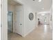 Neutral-toned hallway with tile floors leading to the main areas of the house at 3397 Sagebrush St, Harmony, FL 34773