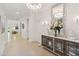 Hallway with chandelier and decorative furniture at 3397 Sagebrush St, Harmony, FL 34773