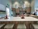 Bright community kitchen with quartz counters, stainless appliances, and island seating at 3397 Sagebrush St, Harmony, FL 34773