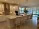 Beautiful kitchen island with white cabinets, stone countertops, and pendant lighting at 3397 Sagebrush St, Harmony, FL 34773