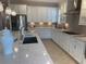 Well-lit kitchen featuring a quartz countertop, stainless steel appliances, and ample cabinet space at 3397 Sagebrush St, Harmony, FL 34773
