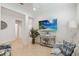 Bright living room with stylish decor, seating area, and a mounted TV at 3397 Sagebrush St, Harmony, FL 34773