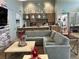 Comfortable living room featuring modern furniture, and access to stainless steel kitchen with counter seating at 3397 Sagebrush St, Harmony, FL 34773