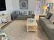 Spacious, well-lit living room with two sofas, soft rug, and neutral color palette at 3397 Sagebrush St, Harmony, FL 34773