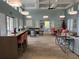 Clubhouse lounge with stylish furniture, modern lighting, and bright, open space at 3397 Sagebrush St, Harmony, FL 34773