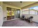 Covered patio with brick floors and comfortable seating area, perfect for outdoor relaxation at 3397 Sagebrush St, Harmony, FL 34773