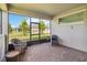Spacious patio with brick floors, comfortable seating, and a view of the lush backyard at 3397 Sagebrush St, Harmony, FL 34773
