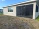 Exterior view of the screened porch and attached home at 3397 Sagebrush St, Harmony, FL 34773