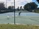 Outdoor tennis court featuring a green and blue surface and sturdy net for an active lifestyle at 3397 Sagebrush St, Harmony, FL 34773