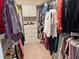 Spacious walk-in closet featuring built-in shelving, drawers, and ample hanging space for organized storage at 3397 Sagebrush St, Harmony, FL 34773