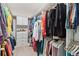 Spacious walk-in closet with custom shelving and ample storage space for clothing and accessories at 3397 Sagebrush St, Harmony, FL 34773