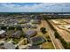 Aerial view of homes and community featuring beautiful landscaping and modern amenities at 344 Cadiz Loop, Davenport, FL 33837