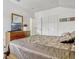 A well-lit bedroom with soft colors, carpeted floors, and ample closet space at 344 Cadiz Loop, Davenport, FL 33837