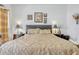 Well-lit bedroom showcasing two nightstands and neutral decor at 344 Cadiz Loop, Davenport, FL 33837