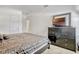 Well-lit bedroom with a queen bed, dark dresser, and carpeted floors at 344 Cadiz Loop, Davenport, FL 33837