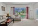 Bright living room with a sliding door offering a view of the pool at 344 Cadiz Loop, Davenport, FL 33837