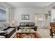 Comfortable living room offers ample seating and a large window for natural light at 344 Cadiz Loop, Davenport, FL 33837