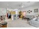 Open-concept floorplan with the kitchen, breakfast bar, and living room flowing together at 344 Cadiz Loop, Davenport, FL 33837