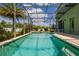 Inviting screened pool and patio with spa, ideal for relaxation and outdoor entertainment at 344 Cadiz Loop, Davenport, FL 33837