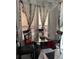 Dining room with modern chandelier, decor, and a glass table at 3772 Huntwicke Blvd, Davenport, FL 33837