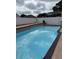 Backyard pool surrounded by white fence at 3772 Huntwicke Blvd, Davenport, FL 33837