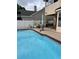 Backyard pool with covered patio and seating at 3772 Huntwicke Blvd, Davenport, FL 33837