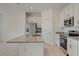 A well-equipped kitchen showcases modern appliances, granite countertops, and ample cabinet space for storage at 398 Eventide Ave, Mascotte, FL 34753