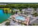 Aerial view of the community pool area, with tennis courts and the lake in the background at 4560 Spigold Court, Kissimmee, FL 34746