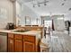Bright and open kitchen with a breakfast bar overlooking the dining and living areas at 4560 Spigold Court, Kissimmee, FL 34746