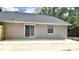 The backyard features a concrete patio, offering a great spot for outdoor activities and potential for landscaping at 5284 Indian Laurel Ct, Orlando, FL 32808