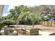 The backyard features outdoor seating and sparse landscaping, creating an ideal space for relaxation and entertainment at 5284 Indian Laurel Ct, Orlando, FL 32808