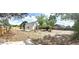Large, partially-fenced backyard with grass area and sparse landscaping, offering privacy and outdoor potential at 5284 Indian Laurel Ct, Orlando, FL 32808