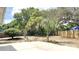 The backyard features a concrete patio, partially-fenced, offering a great spot for outdoor activities and landscaping at 5284 Indian Laurel Ct, Orlando, FL 32808