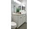 Bathroom featuring a white vanity with dual mirrors, light countertops and decor at 5284 Indian Laurel Ct, Orlando, FL 32808