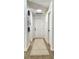 Bright hallway with wood flooring, crisp white walls, and decorative accents, offering a welcoming transition space at 5284 Indian Laurel Ct, Orlando, FL 32808