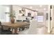 Stylish eat-in kitchen with modern appliances, white cabinetry, and a cozy dining area at 5284 Indian Laurel Ct, Orlando, FL 32808