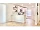 Updated kitchen with white cabinets, stylish backsplash, and modern appliances at 5284 Indian Laurel Ct, Orlando, FL 32808